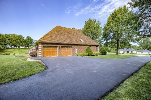 view of side of property with a yard