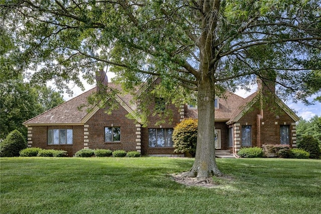 log-style house with a front yard