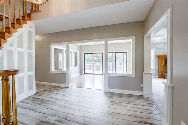 interior space featuring ceiling fan and light wood-type flooring