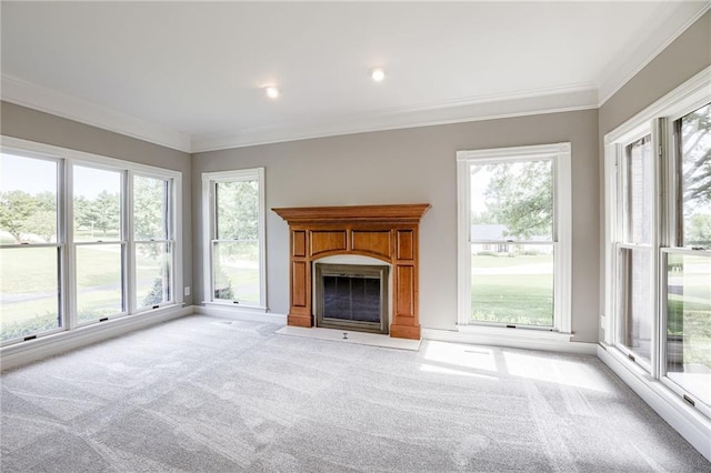12815 NW 145th St, Platte City, MO 64079 - unfurnished living room featuring a fireplace with flush hearth, plenty of natural light, crown molding, and light colored carpet