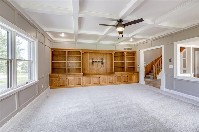 12815 NW 145th St, Platte City, MO 64079 - unfurnished living room featuring a decorative wall, coffered ceiling, and beamed ceiling