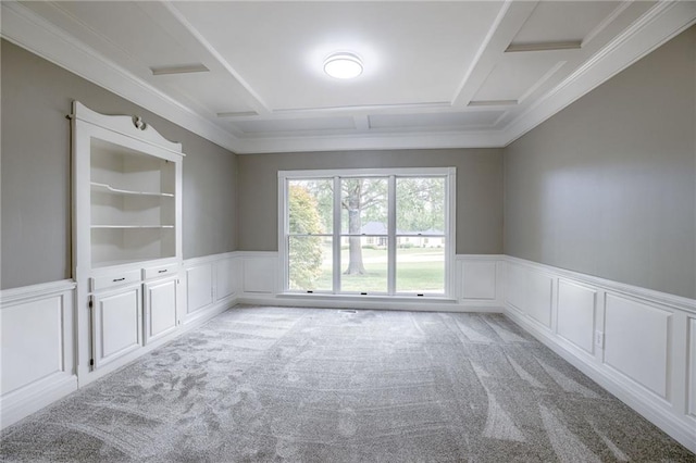 carpeted spare room with built in features and ornamental molding