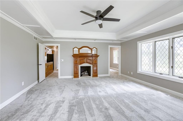 unfurnished living room featuring light carpet, ceiling fan, and crown molding