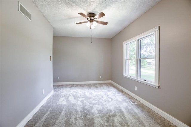 12815 NW 145th St, Platte City, MO 64079 - carpeted spare room with baseboards, a textured ceiling, visible vents, and a ceiling fan