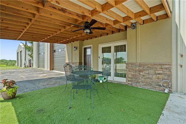 view of patio featuring ceiling fan