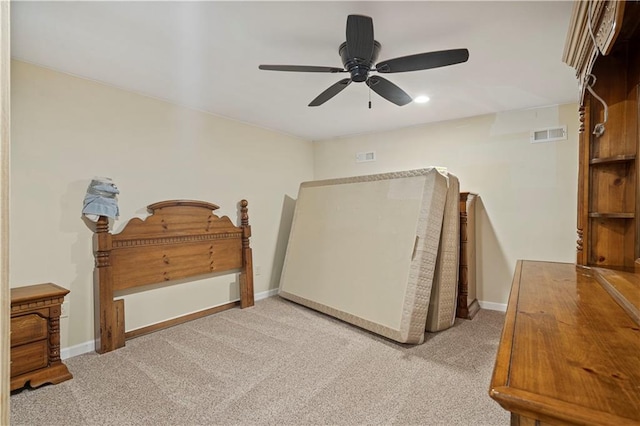 bedroom featuring light colored carpet and ceiling fan