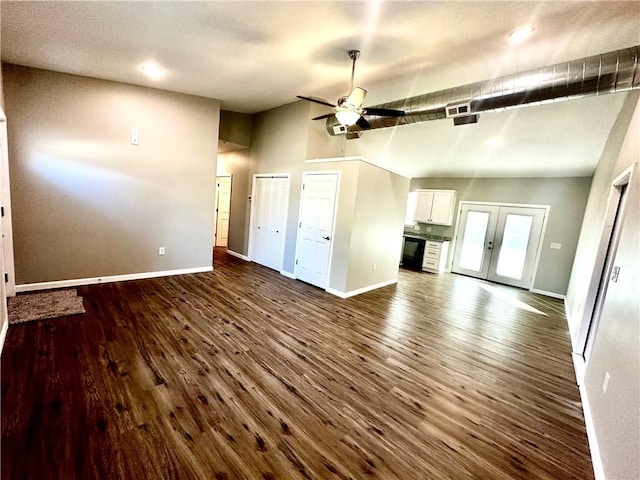 unfurnished living room with ceiling fan, dark hardwood / wood-style flooring, and french doors