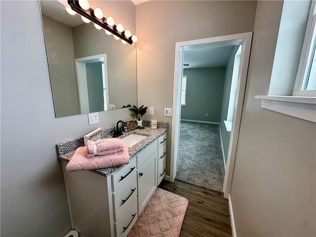 bathroom with vanity and wood-type flooring