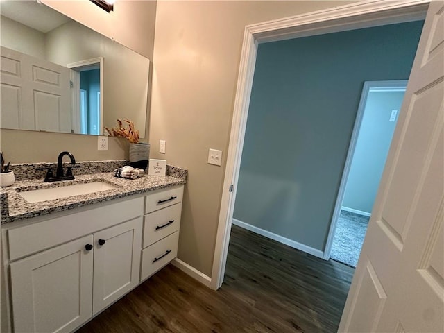 bathroom with vanity and wood-type flooring