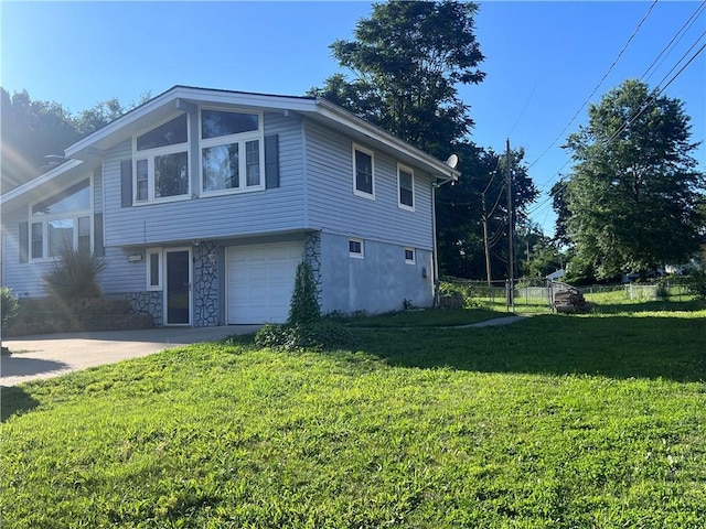 view of home's exterior with a yard and a garage