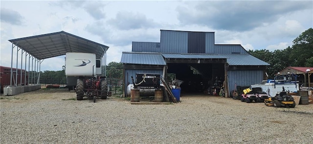 back of property featuring a carport