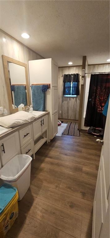 bathroom with hardwood / wood-style floors and vanity