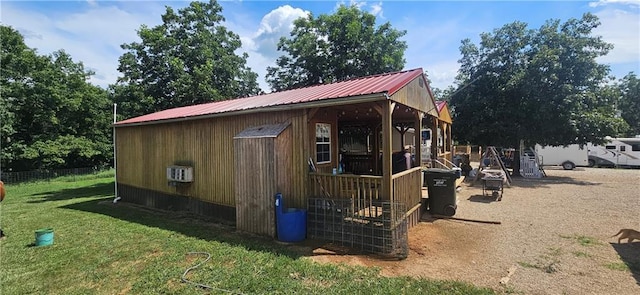 view of outbuilding with a lawn