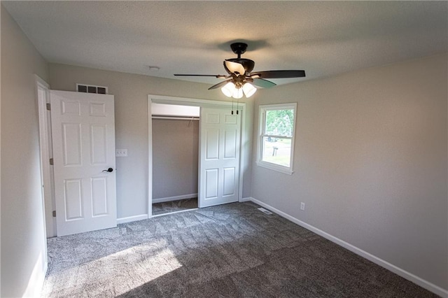 unfurnished bedroom with carpet, a closet, visible vents, ceiling fan, and baseboards