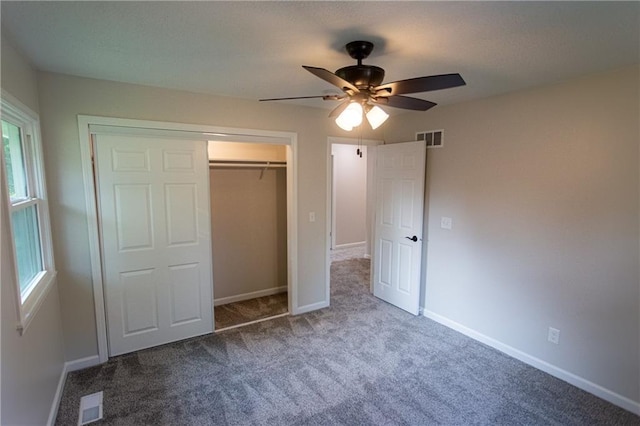 unfurnished bedroom featuring baseboards, visible vents, and a closet