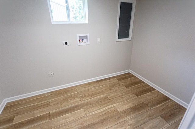 laundry room with light wood-style flooring, hookup for an electric dryer, laundry area, washer hookup, and electric panel