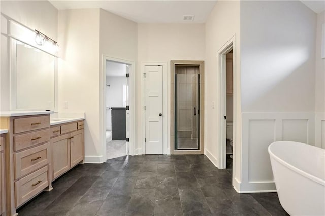 bathroom featuring plus walk in shower and vanity