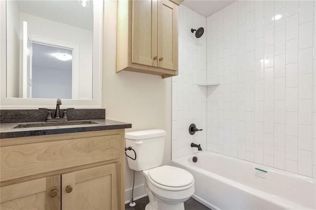 full bathroom with vanity, toilet, and tiled shower / bath combo