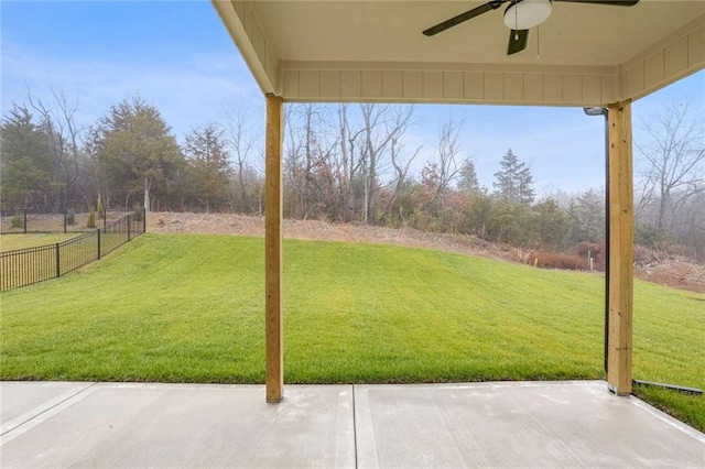 view of yard with ceiling fan and a patio