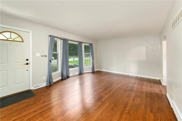 entrance foyer featuring dark hardwood / wood-style flooring