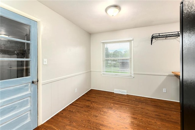 unfurnished room featuring dark hardwood / wood-style floors