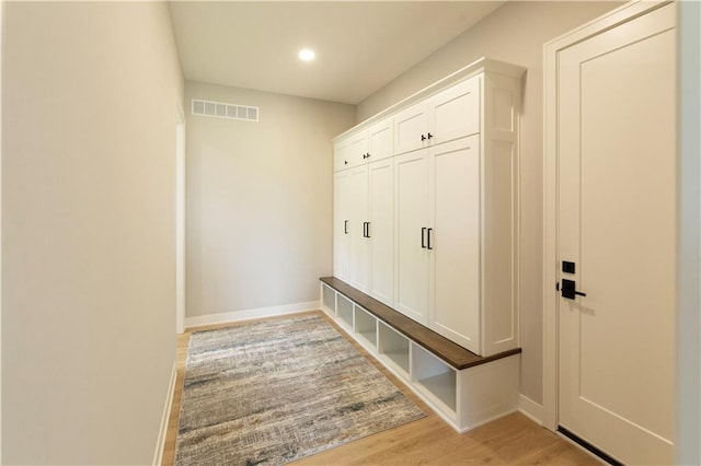 mudroom with light hardwood / wood-style flooring