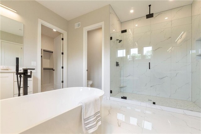 bathroom with separate shower and tub and toilet