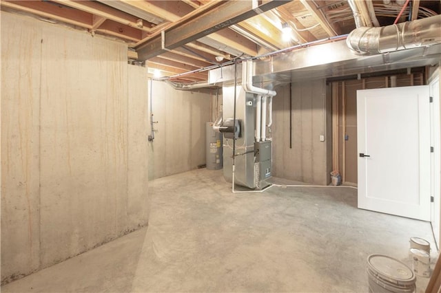 basement featuring heating unit and water heater