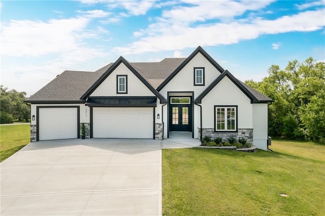 view of front of property featuring a garage and a front yard