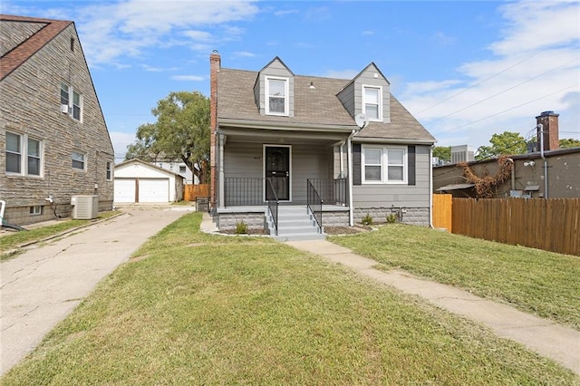 cape cod home featuring a front yard, an outbuilding, covered porch, central AC unit, and a garage