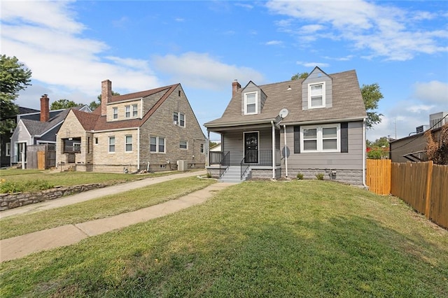 cape cod house with a front lawn and a porch