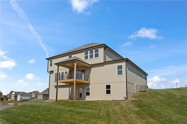 7075 NW Magnus Ct, Parkville, MO 64152 - back of property featuring a balcony, a lawn, and ceiling fan