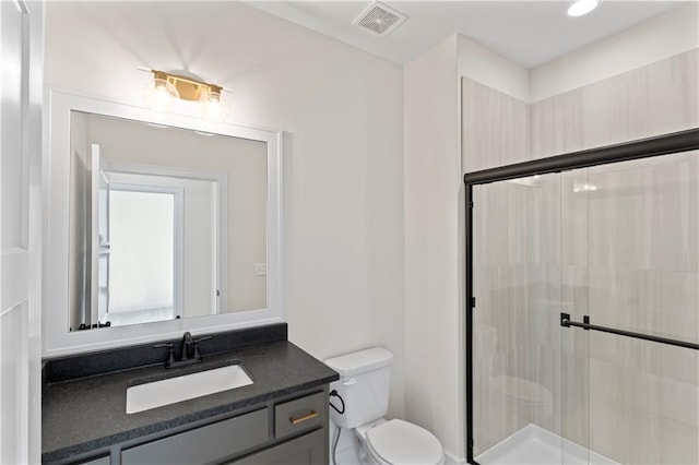 7075 NW Magnus Ct, Parkville, MO 64152 - full bathroom featuring a stall shower, toilet, and vanity