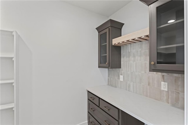 7075 NW Magnus Ct, Parkville, MO 64152 - kitchen with tasteful backsplash and glass insert cabinets