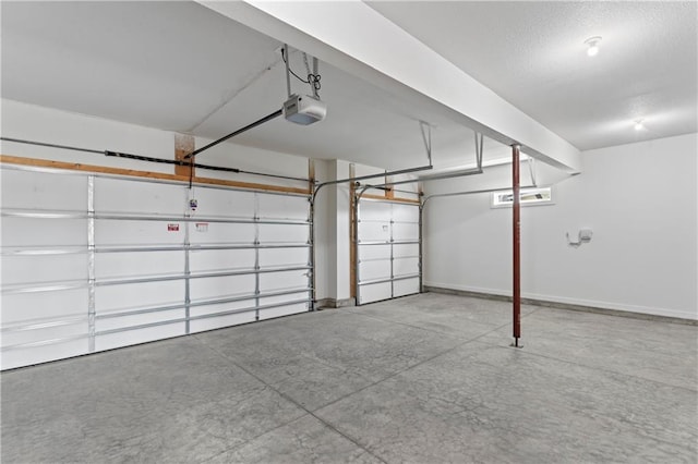 7075 NW Magnus Ct, Parkville, MO 64152 - garage featuring a garage door opener and baseboards