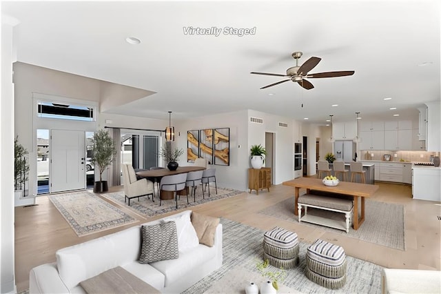 7075 NW Magnus Ct, Parkville, MO 64152 - living room featuring ceiling fan, light wood-style floors, and recessed lighting