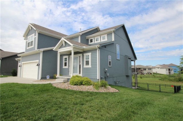 view of front of house with a garage and a front lawn