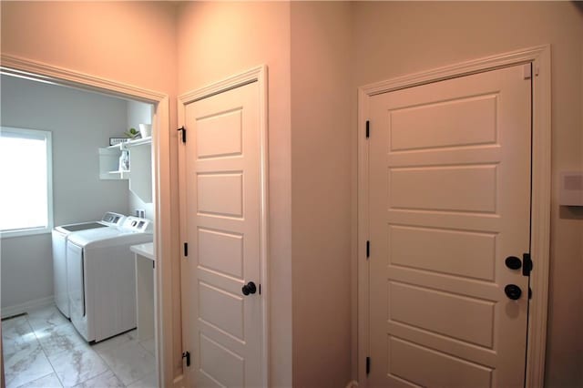 washroom with washing machine and clothes dryer