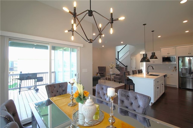 dining space featuring dark hardwood / wood-style floors and sink