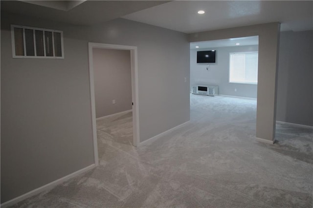 empty room featuring light carpet