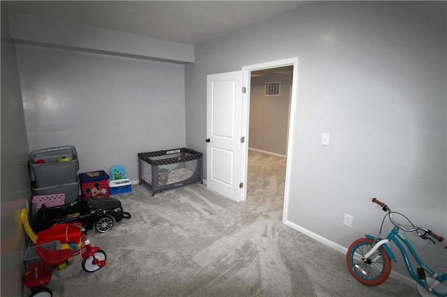 playroom featuring light colored carpet