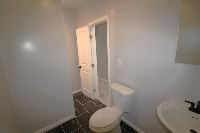 bathroom with sink and toilet