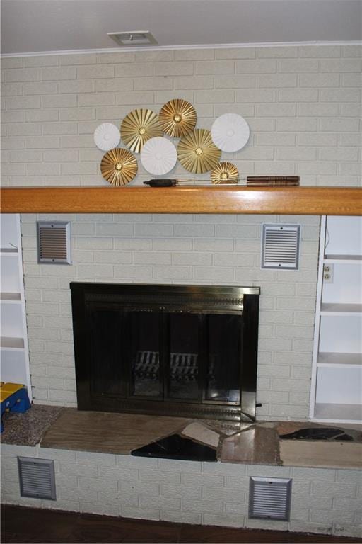 room details featuring a brick fireplace