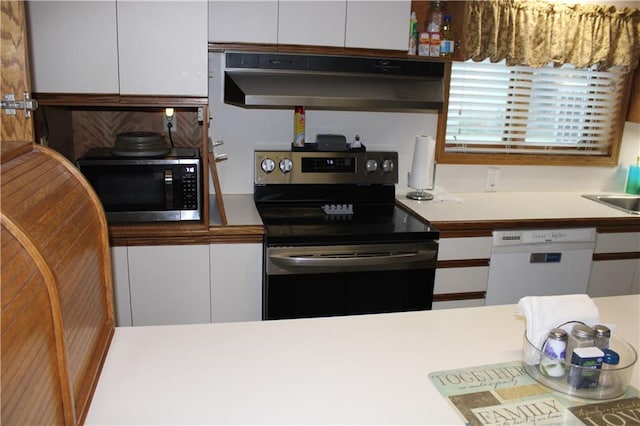 kitchen with white cabinetry, appliances with stainless steel finishes, and sink