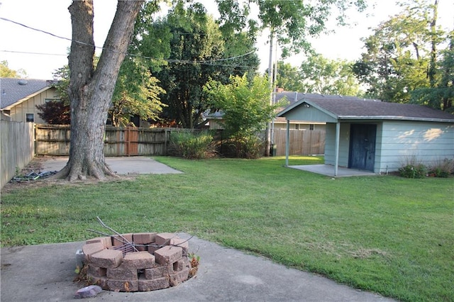 view of yard featuring a patio area and a fire pit