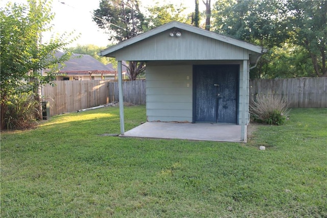 view of outbuilding with a lawn