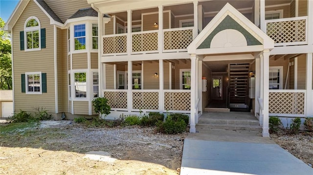 doorway to property with covered porch