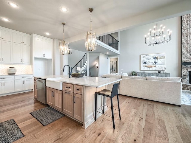 17212 Nieman Rd, Overland Park, KS 66221 - kitchen featuring a chandelier, dishwasher, a sink, open floor plan, and recessed lighting