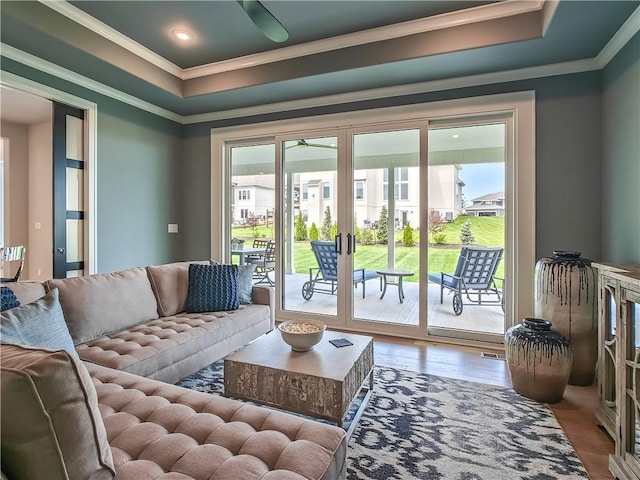 17212 Nieman Rd, Overland Park, KS 66221 - living room with crown molding, a ceiling fan, wood finished floors, french doors, and a tray ceiling
