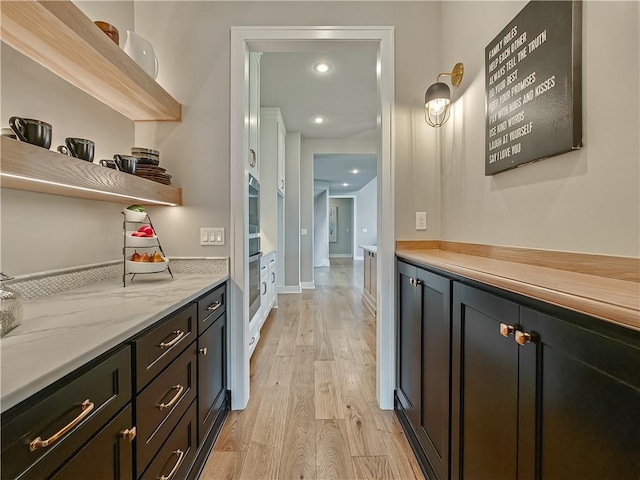 17212 Nieman Rd, Overland Park, KS 66221 - bar featuring stainless steel oven and light wood-type flooring